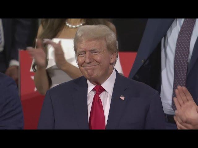 Donald Trump enters Republican convention hall with a bandaged ear and gets a hero's welcome