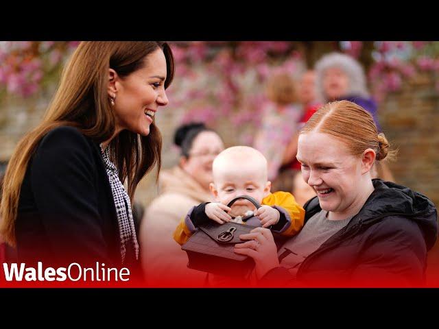 Adorable moment baby grabs Kate Middletons bag during Royal Visit and won't give it back