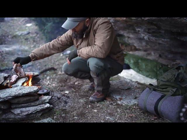 Survivor bushcraft On the mountain, overnight in a natural shelter. cooking on a stone lab