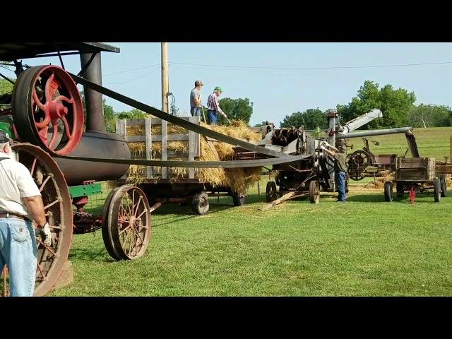 1913 Aultman Taylor steam tractor running a threshing machine