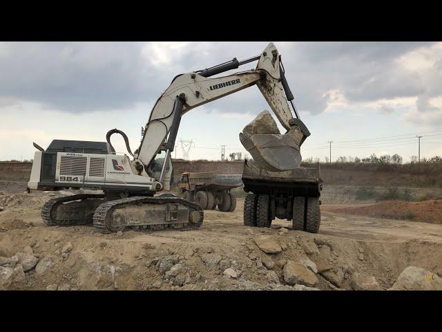 Liebherr 984 Excavator Loading Rocks On Caterpillar 773D And Terex Dumpers - Kivos Ate