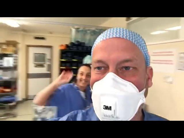 Recovered doctor back treating patients in the emergency room