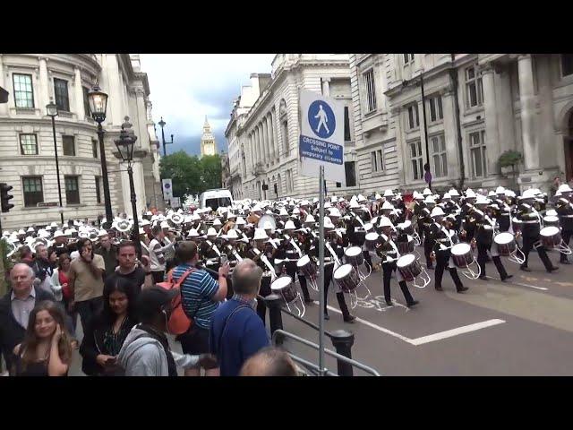 Massed Bands of HM Royal Marines marching back to Wellington Barracks after Beating Retreat 2024