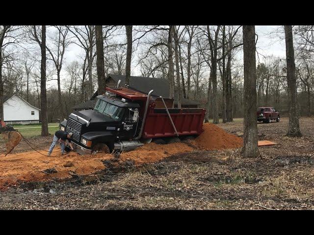 Pulling Out A Stuck Dump Truck! Kubota Excavator Trackhoe Mud Buried