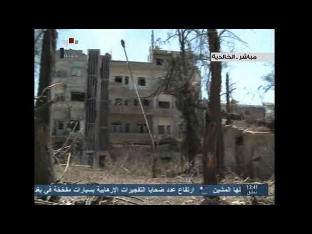 Syrian TV shows impact of heavy shelling in Homs