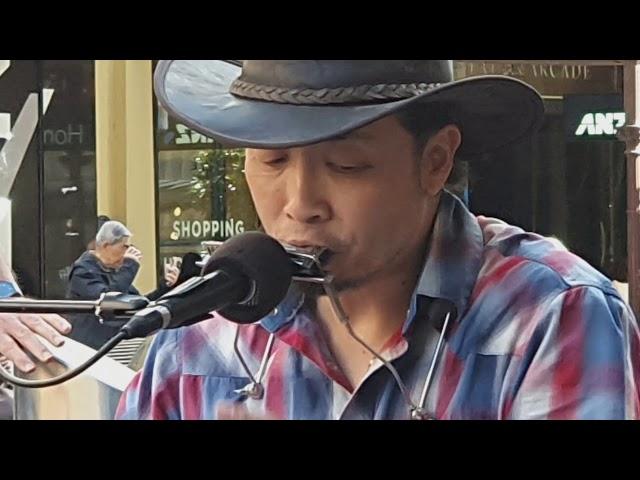 Busking Japanese Man playing blues in the heart of Melbourne