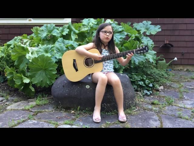 7-year old singer songwriter playing improv guitar