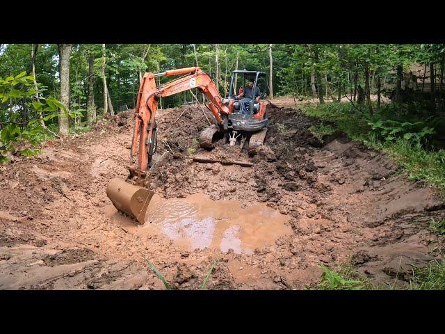 Welding an excavator bucket and digging pond