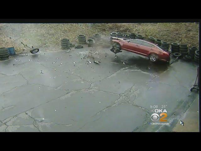 Video: Car Flies Off Parkway West, Crashes Into Auto Shop