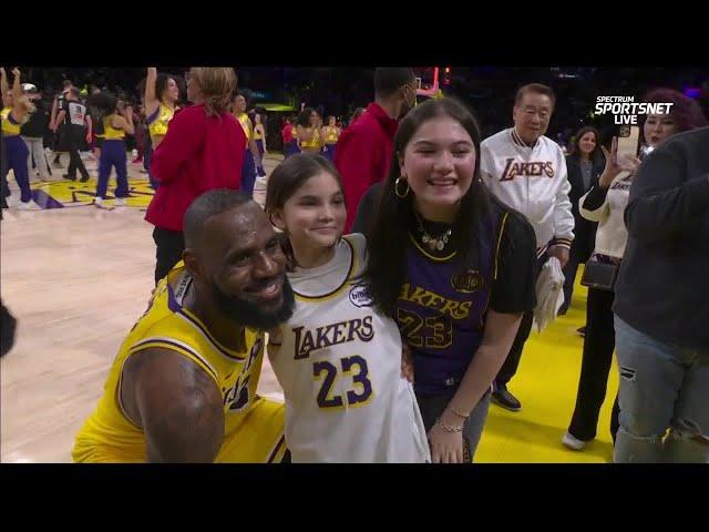 LeBron takes picture with young fan after win over the Miami Heat  | NBA on ESPN