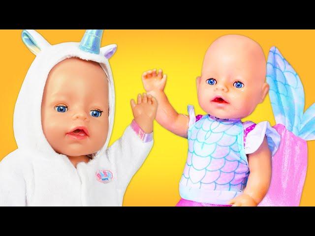 La bambola Baby Born vuole diventare una sirenetta. Bambole sirene. Giochi per i bambini piccoli