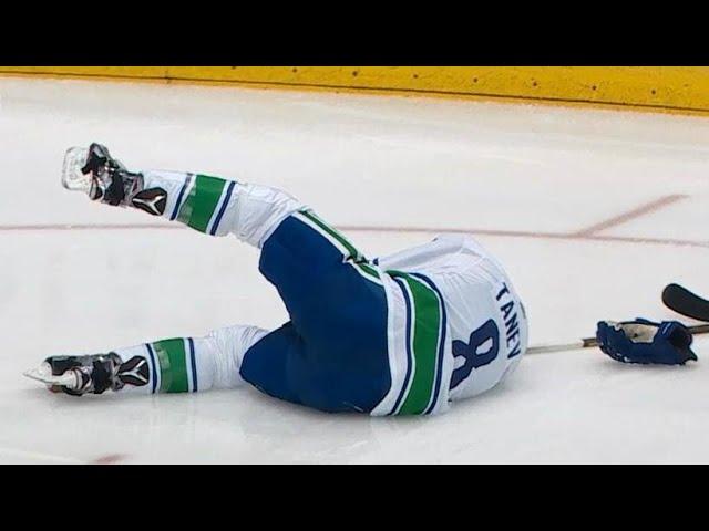 Tanev drops after Marner deflects puck straight to his face