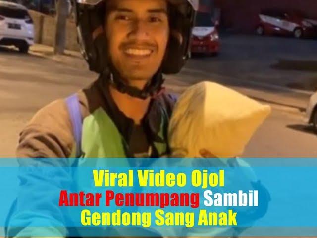 Viral Video Ojol Antar Penumpang Sambil Gendong Anak