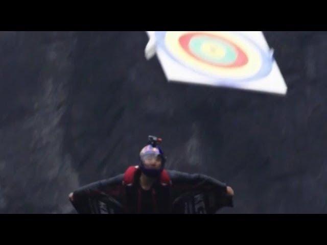 Wingsuit flying target strike wows spectators | CCTV English