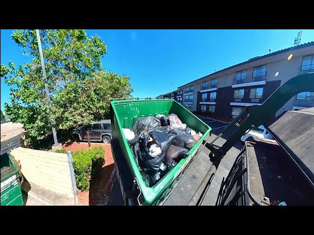 Waste Management front loader garbage truck working route