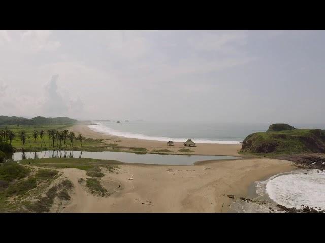 Lonely beach with white sands and waves