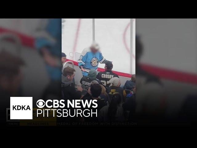 Penguins fan ejected after swiping puck from young fan