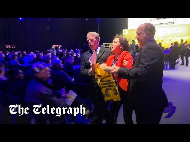 Shell protesters rush stage as hijacked AGM descends into chaos