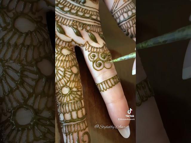 Why do brides hide the grooms name in their mehndi?