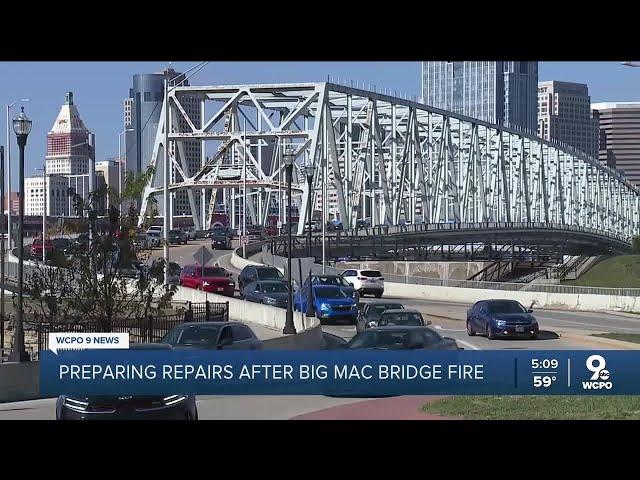 Crews begin the work to repair Daniel Carter Beard Bridge after fire