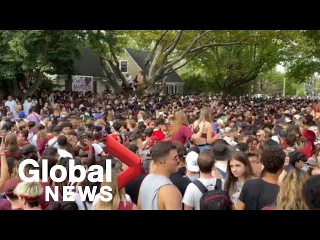 Thousands gathers for "fake" McMaster University homecoming street party, police lay charges