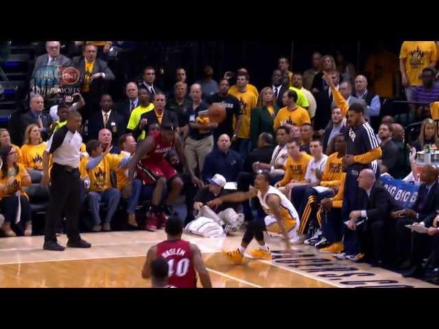 LeBron James falls into Shaq's lap!