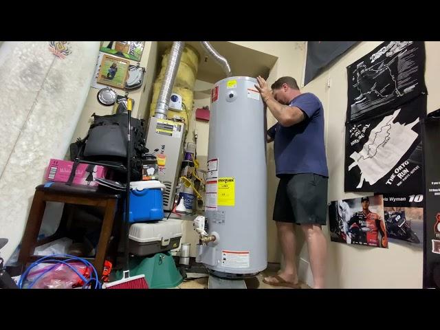Refrigeration guy changes out a water heater