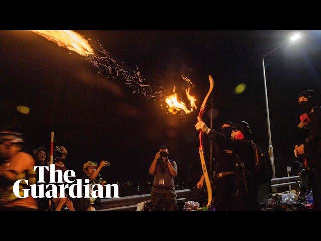 Hong Kong protesters shoot arrows at police during clashes at Chinese University