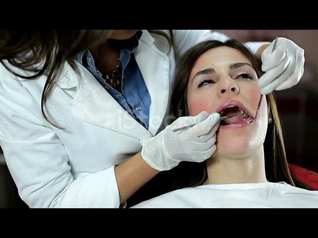 Girl at the dentist gets a dental scraping by an evil dentist