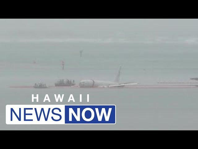 Large military aircraft overshoots runway, ends up in Kaneohe Bay