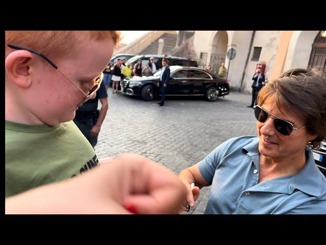 Marley gets his Top Gun Maverick shirt signed by Tom Cruise while in Rome