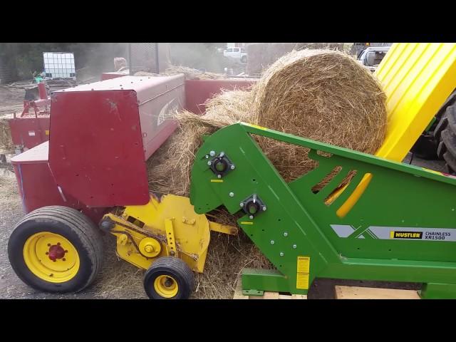 Hustler Chainless XR1500 Demo, feeding round bales into a small square baler