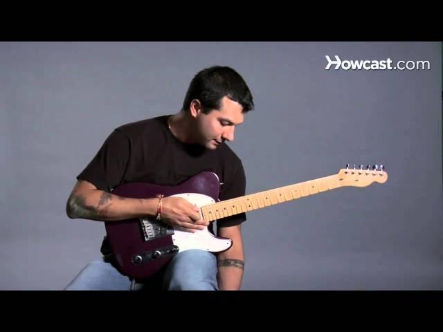 How to Hold a Guitar While Sitting | Guitar Lessons