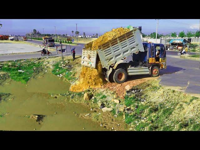 Nicely Project,Showing Action Machinery Working, Land filling,Bulldozer KOMATSU D31P,Truck unloading