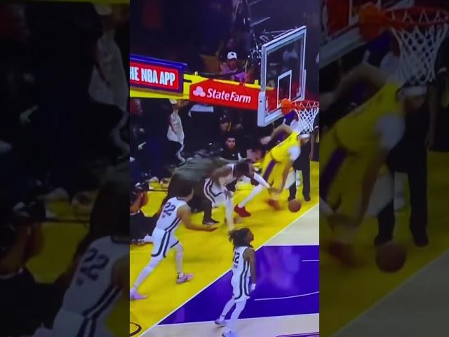 Lakers fan hits Grizzlies Player on court?? Then stands over him. Playoff (Watch slomo)