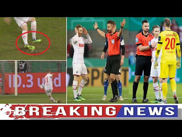 FC Koln player Florian Kainz consoled by referee after illegal penalty is disallowed vs Hamburg