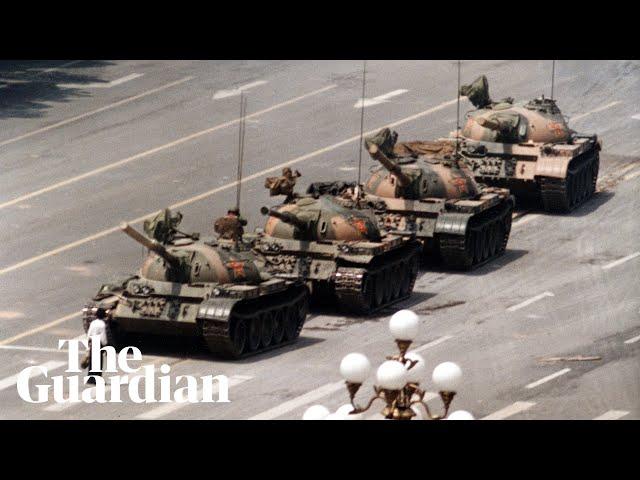 Tank Man: hero of 1989 Tiananmen protest stands in front of tanks – archive video