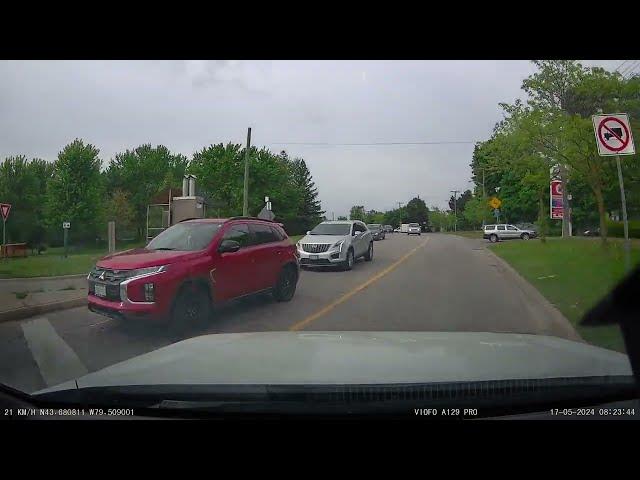 Close Call: Car Narrowly Avoids Crash in Busy Toronto Intersection!