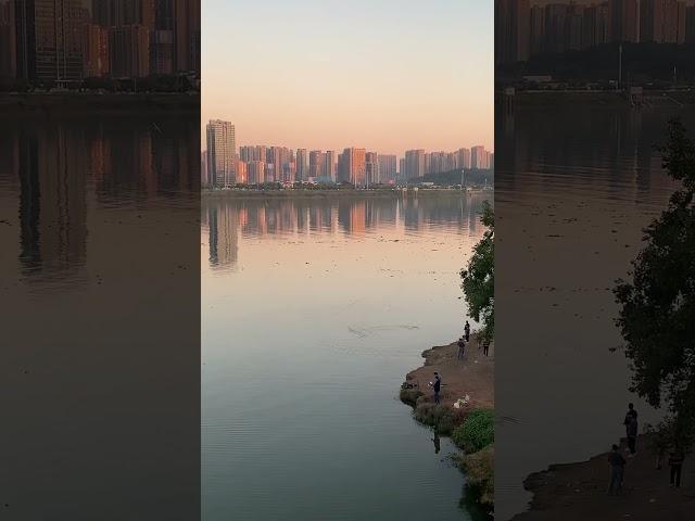 Take a walk. Someone play with seaplane model on the river.