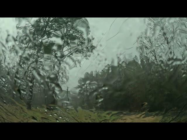 Raining on a windshield in a parked car