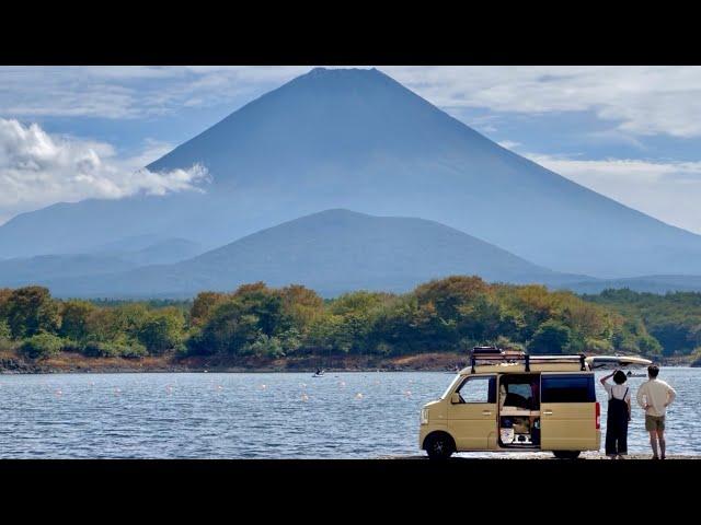 Two people living in a micro van that is too small.