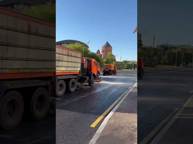 In Moscow, municipal services wash the roads. Hot day.