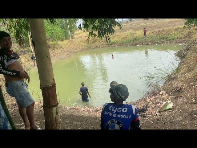 Enjoying a good time fishing at the rice field pond