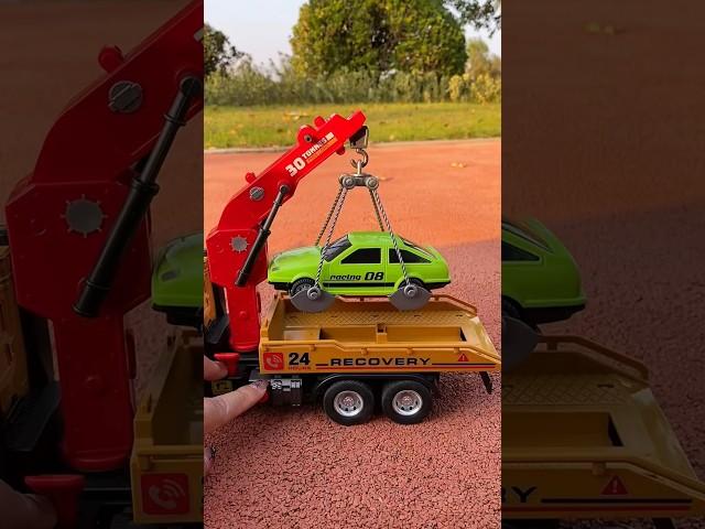 Big Tow Truck Toy with Friction Powered Crane, Lights & Sounds - Roadster with Hooks & Car Included