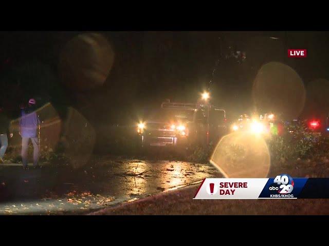 Storms topple power lines, flood roads