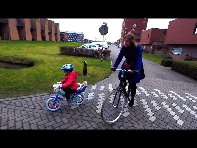 3 year old Dutch kid riding a bike in Holland