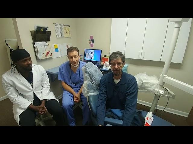 Dr. Lasorsa and Dr. Mack talk to their patient Tom about dental implants