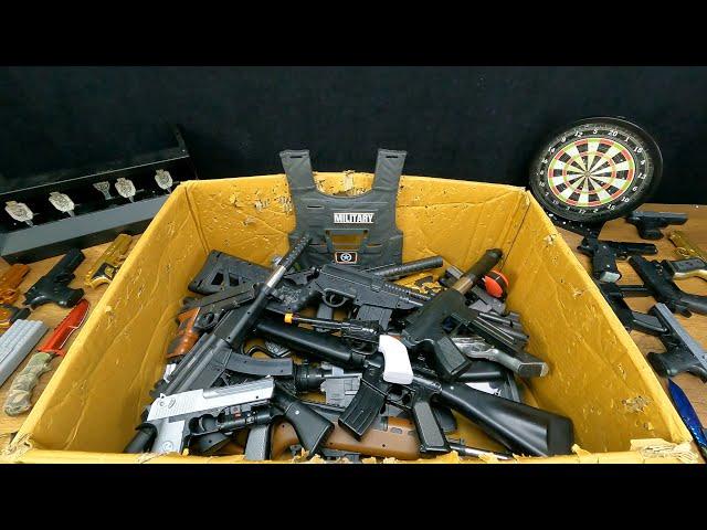 Box of Black Realistic Guns, Capsule Detonator and Bead Shot Pistols