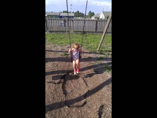 Esme swinging at Small World