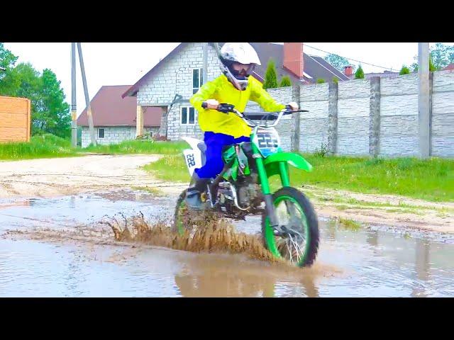 Brothers ride motorcycles through large puddles